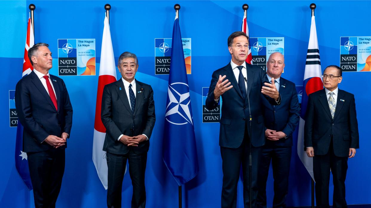 Representatives of NATO and its Indo-Pacific partners stand together at the 2025 NATO Summit in The Hague