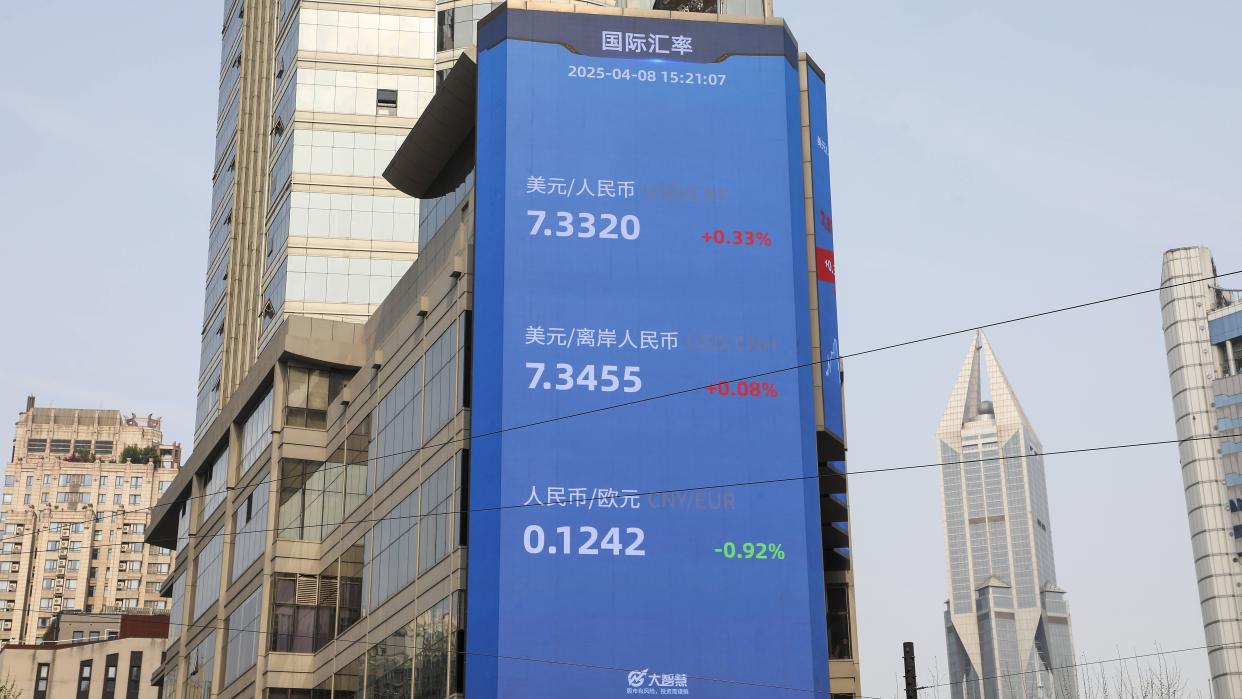 An outdoor electronic screen shows the central parity rate of the Chinese currency renminbi, or the yuan against the U.S. dollar on April 8, 2025 in Shanghai, China.
