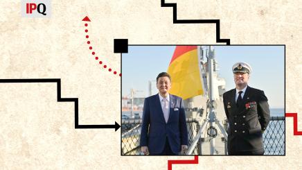 Japan’s Defense Minister Nobuo Kishi poses for a photograph with Tilo Kalski, captain of the German Navy frigate, as he visits the German navy frigate Bayern, docked at the International Cruise Terminal, in Tokyo, Japan November 5, 2021.