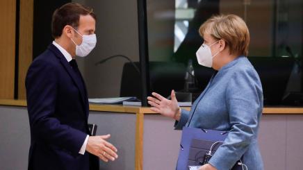 Photo of Emmanuel Macron and Angela Merkel speaking at an EU summit in October 2020