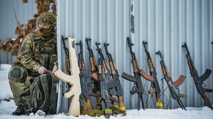 Military training for the civilian population by Azov members in Kiev, Ukraine A member of the Azov batallion prepares his equipment before teaching to volunteers for the Territorial Defense Brigades of Kiev during a military exercise in the outskirts of the city.