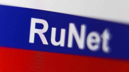 Illustration of a Russian flag and the word RuNet displayed on a laptop screen